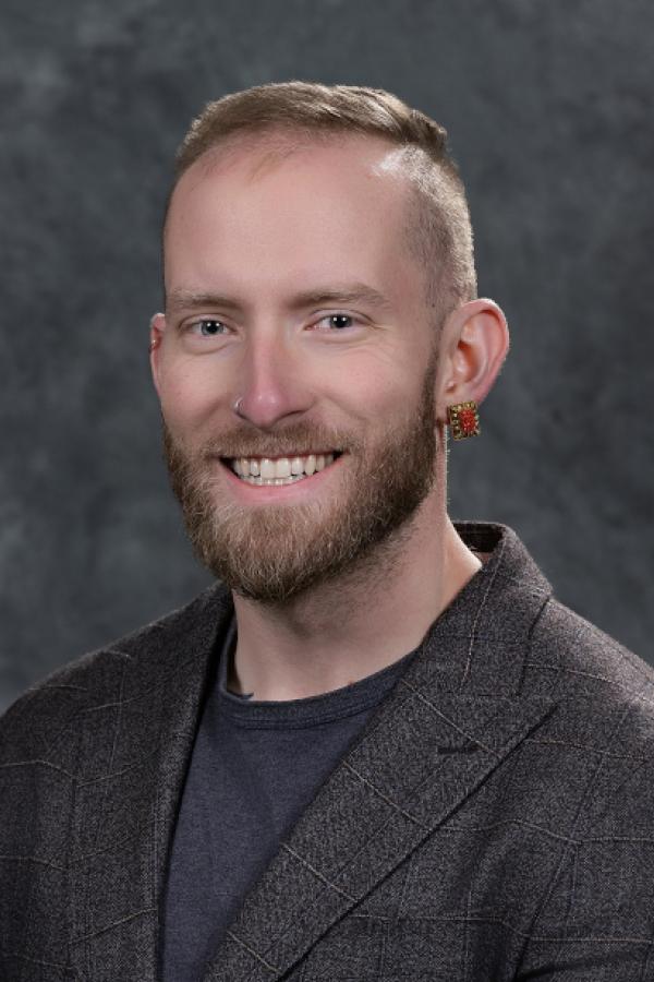 Portrait of board member Luke Spooner